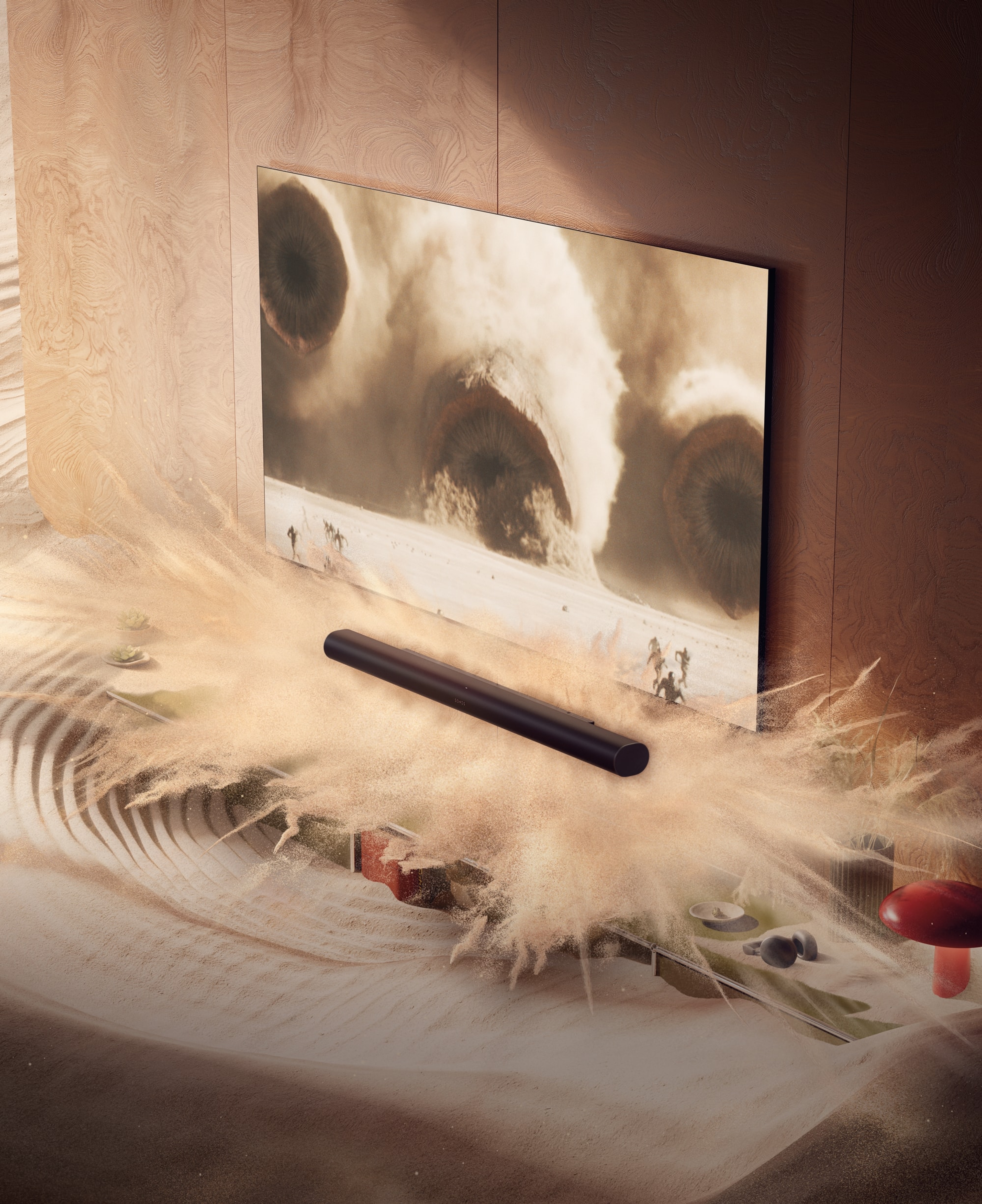 Eine Arc Ultra in einem Wohnzimmer mit animiertem Sand und Bildschirminhalten von Dune 2